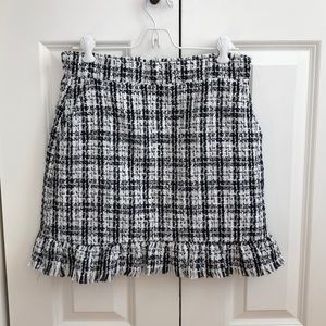 Tweed skirt with ruffle on bottom